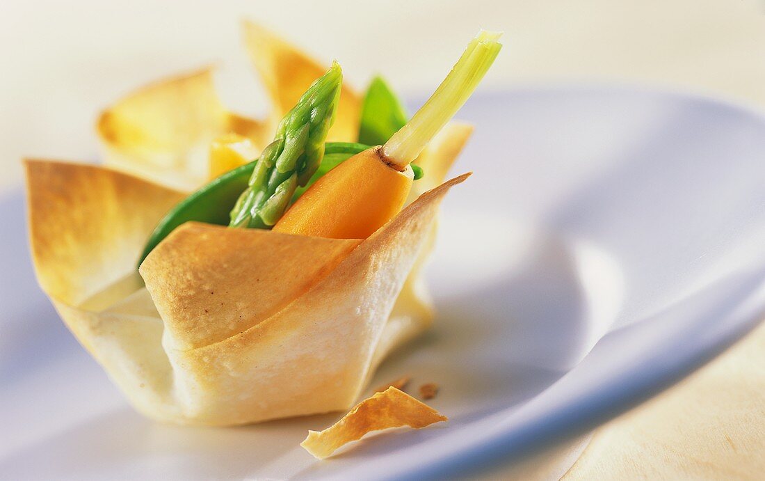 Yufka pastry tartlet with vegetable filling on plate