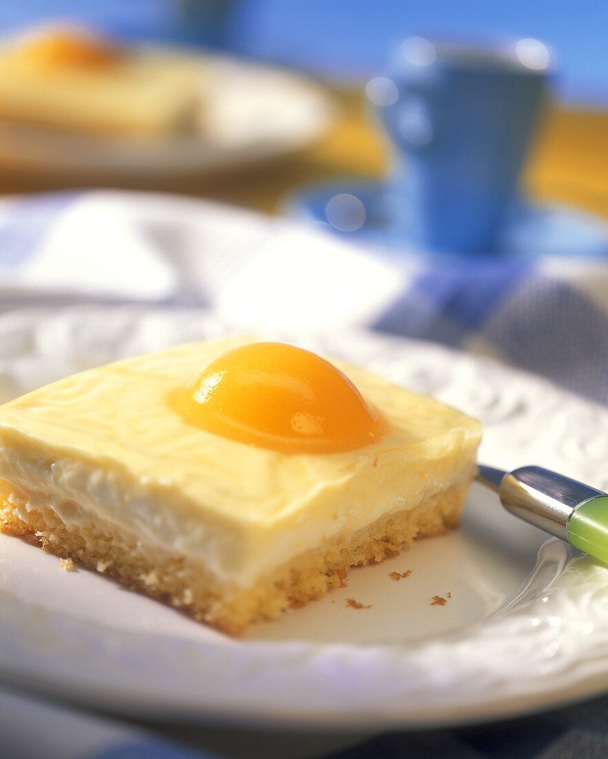 Piece of fried egg cake with apricots