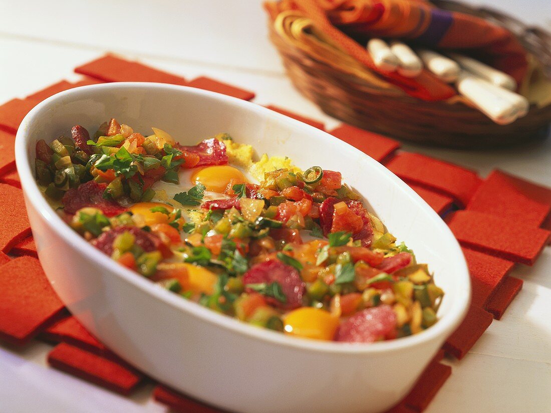 Egg and salami polenta with tomatoes and peppers