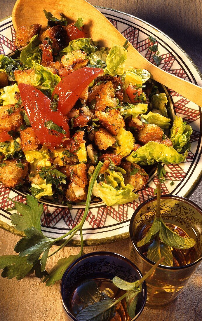 Arabic bread salad with tomatoes and romaine