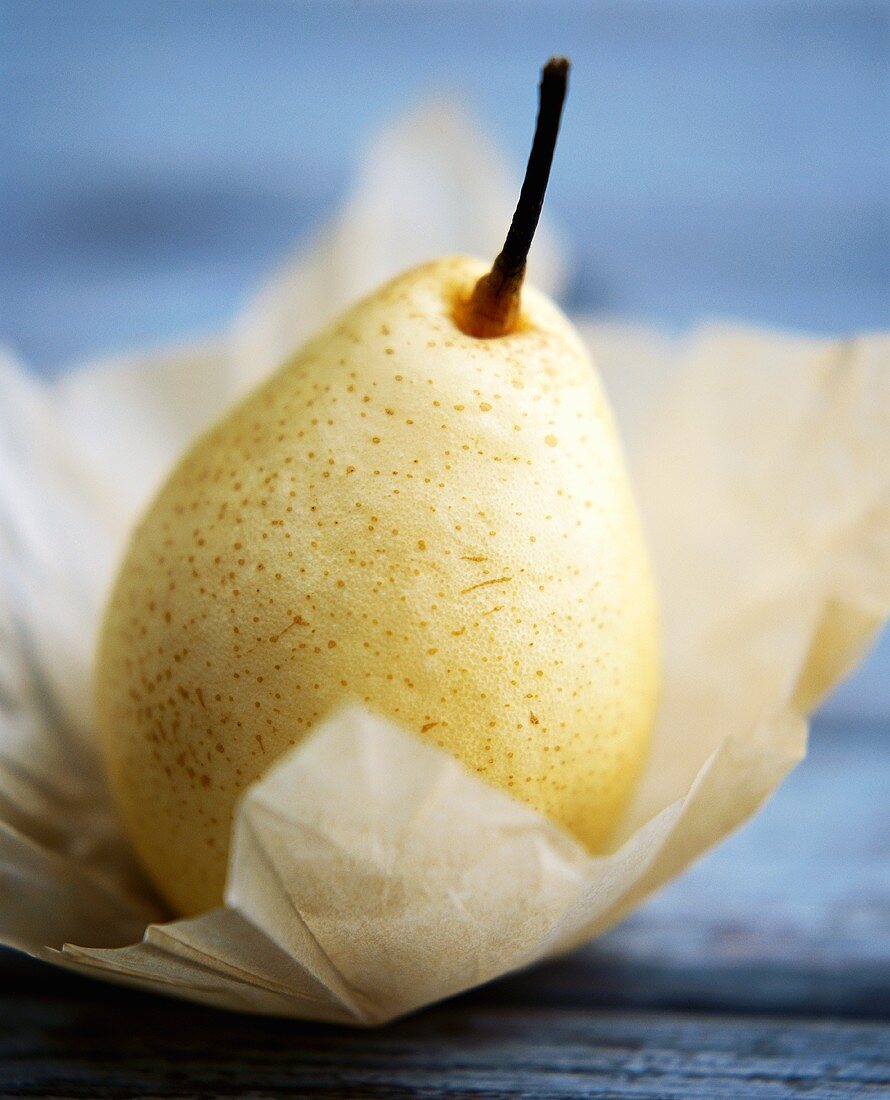 Pear on light-coloured paper