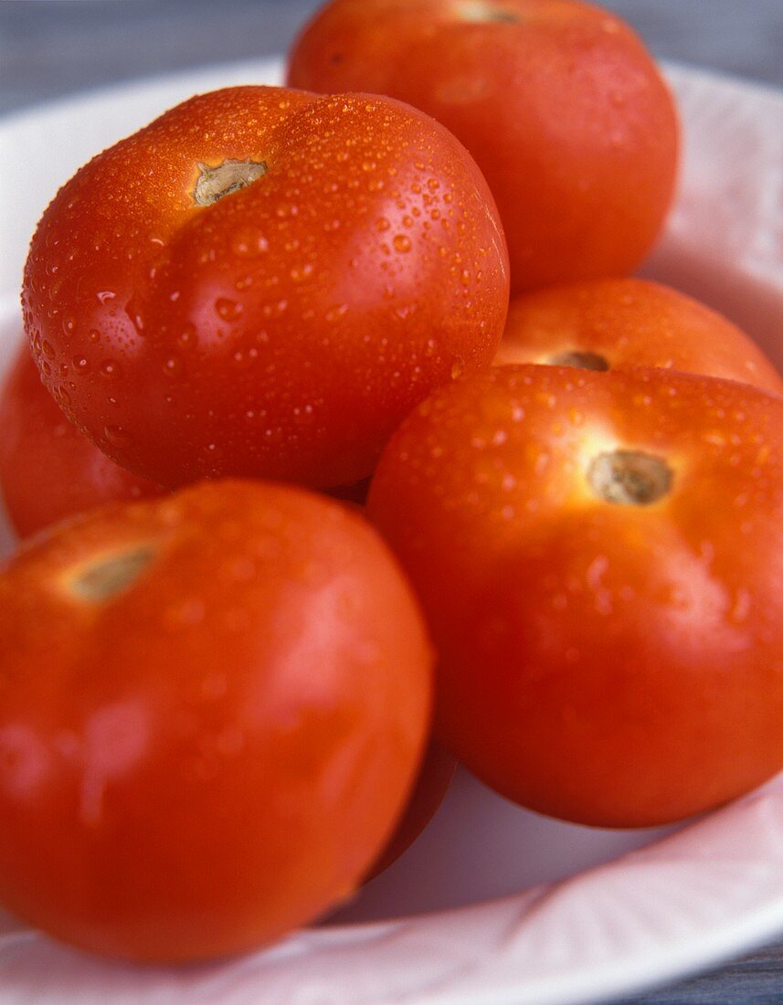 Tomatoes on white plate