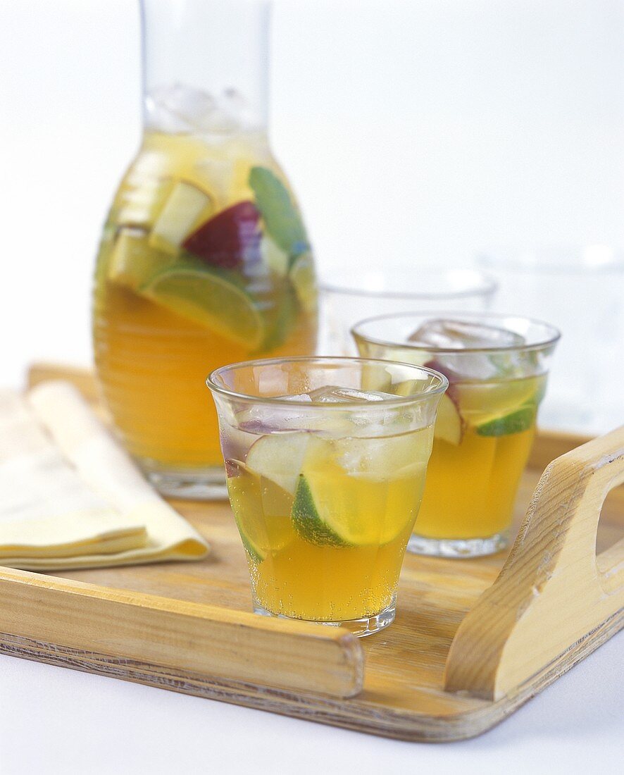 Ginger and lime drink in jug and glasses