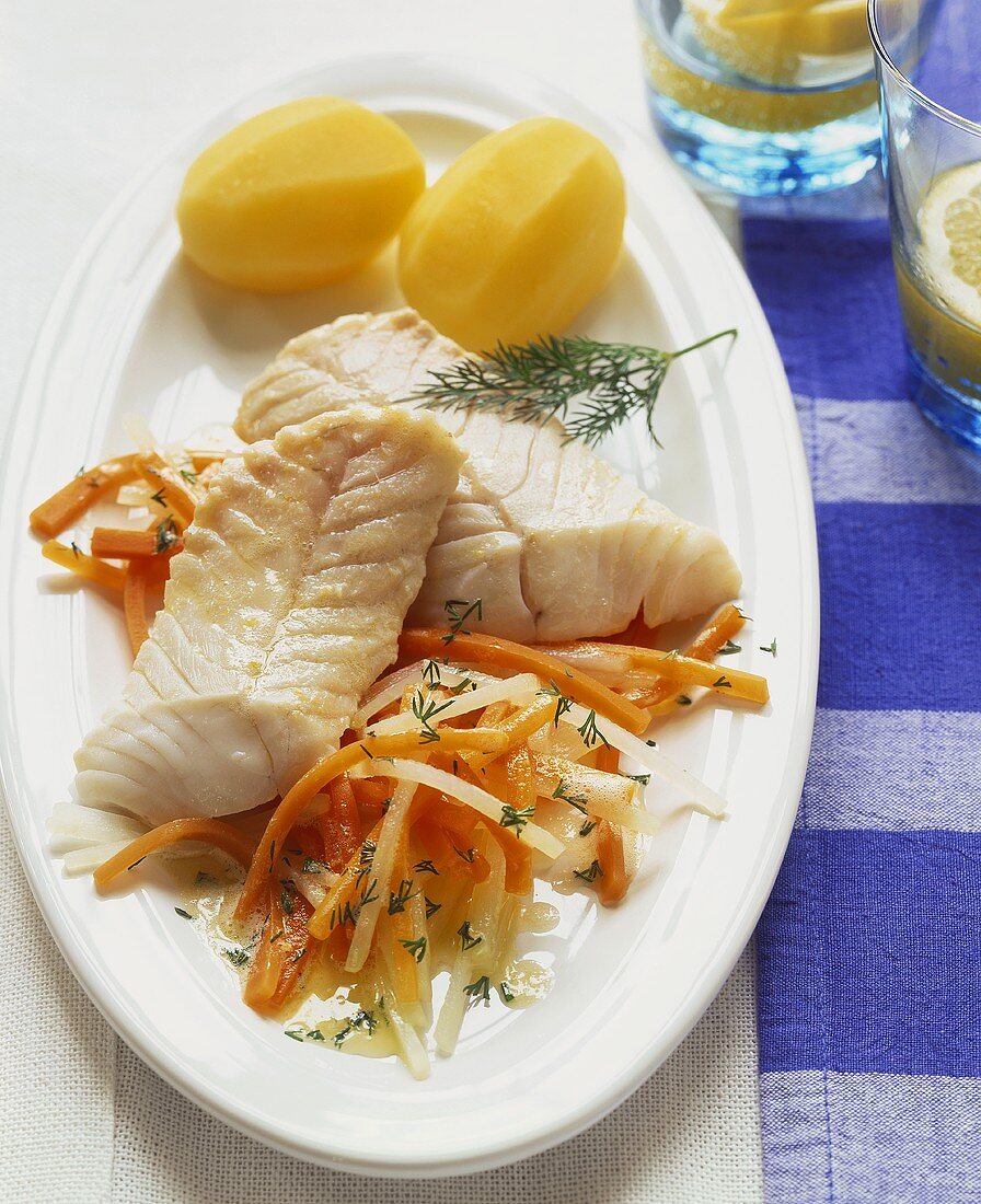 Coley fillet on spring vegetables with boiled potatoes