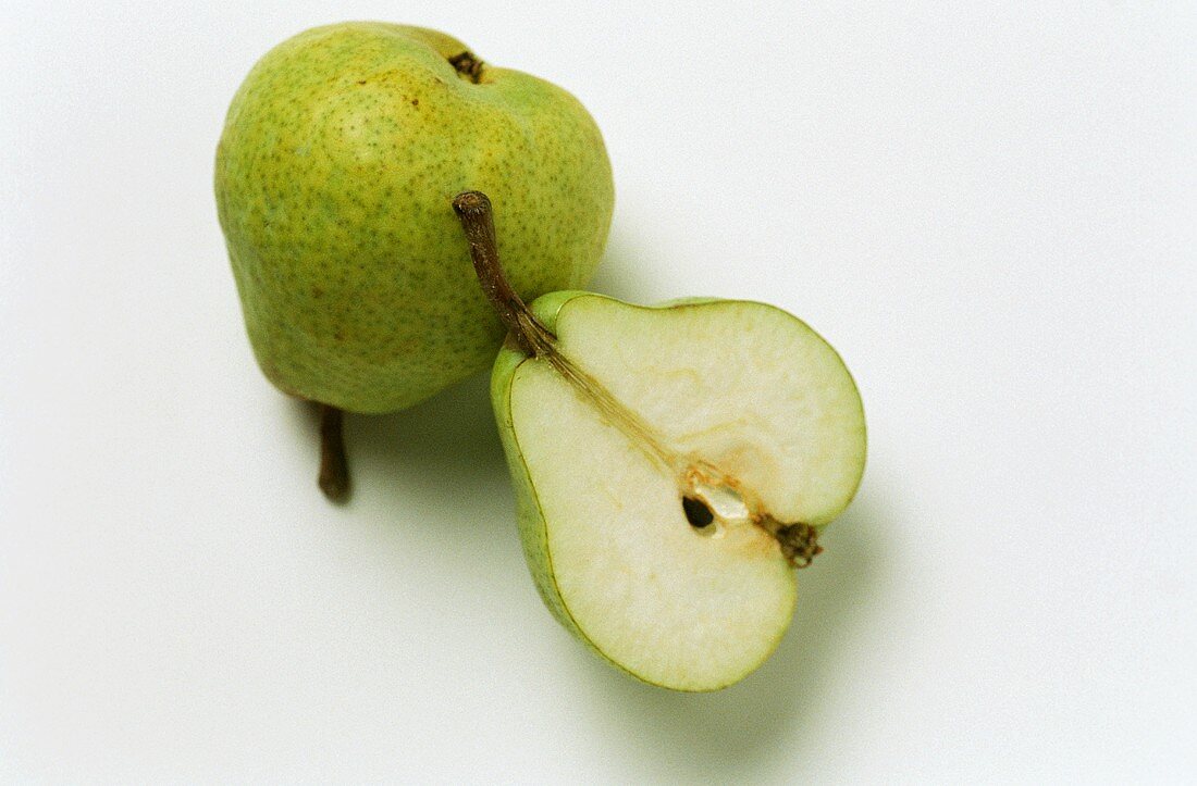 Two pears, one halved