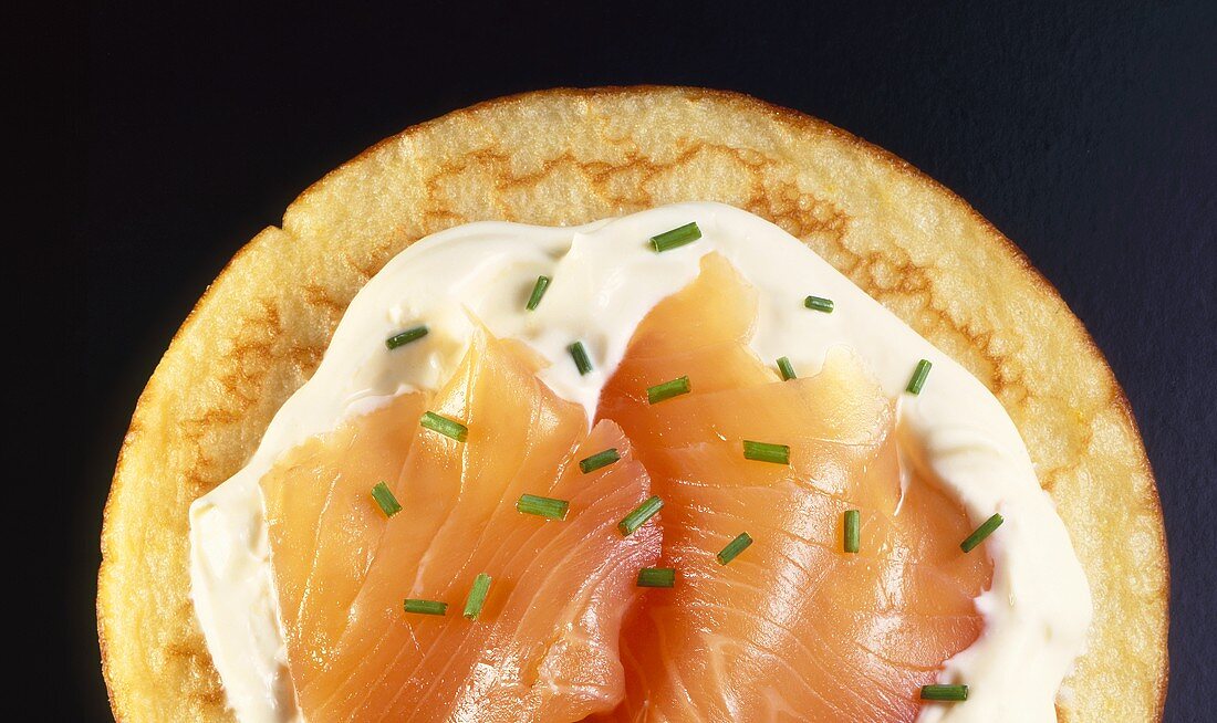 Blini with salmon, sour cream and chives