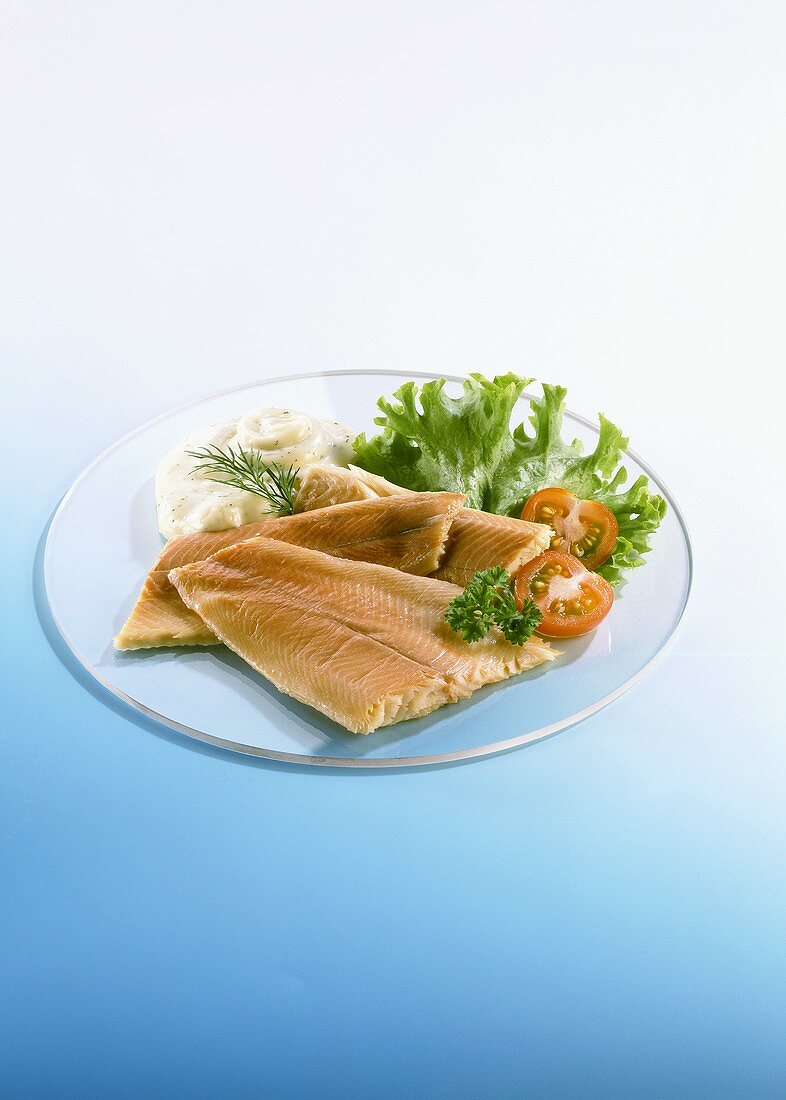 Trout fillets with mayonnaise and salad garnish