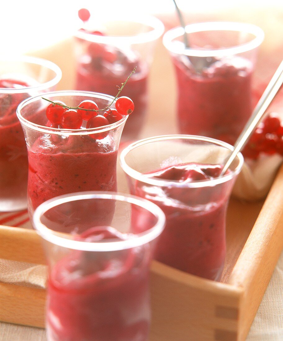 Redcurrant mousse in glasses on tray