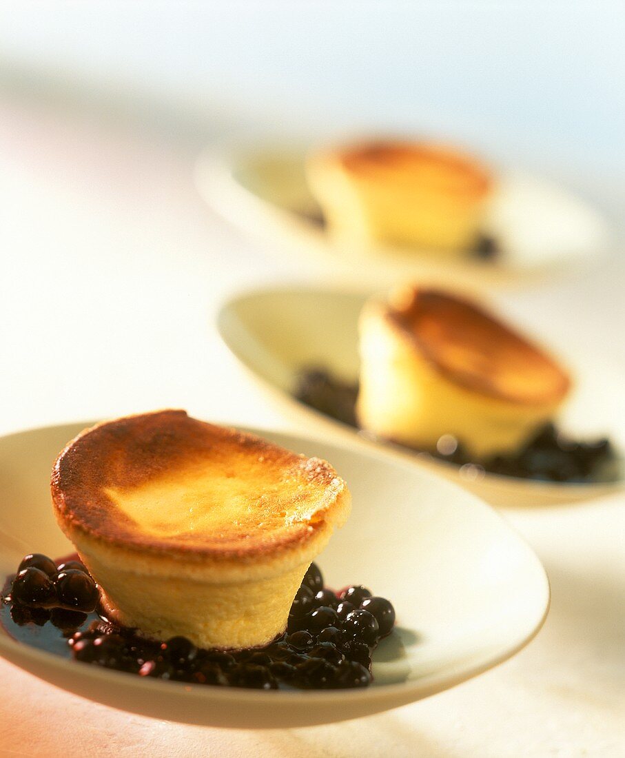 Small soufflés on blueberry compote