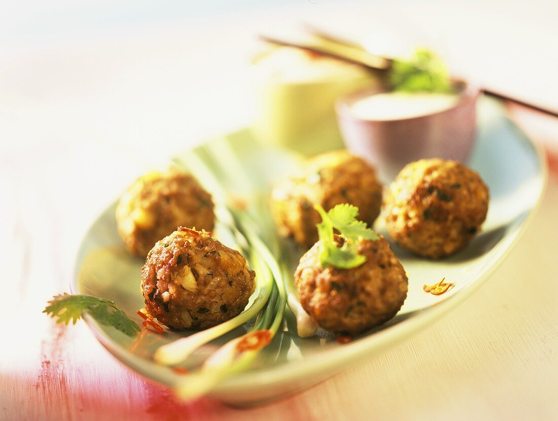 Coriander meatballs with spicy dips