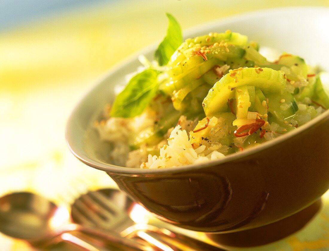 Cucumber salad with sesame and chili on rice