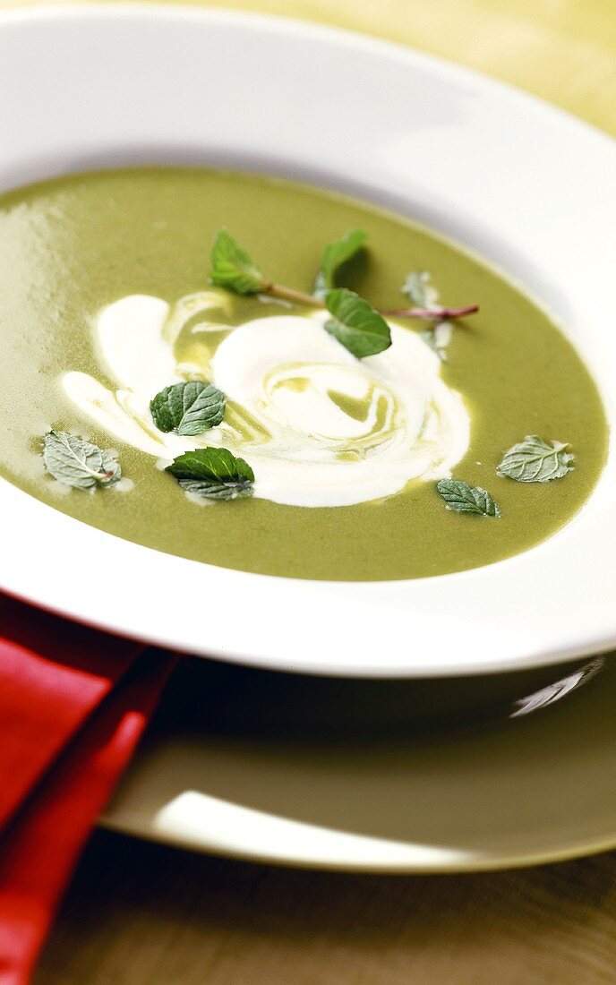 Creamed pea soup with fresh mint and crème fraiche