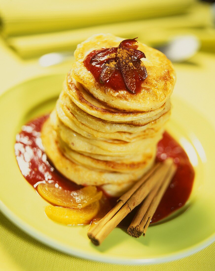 Pancakes with peach and plum sauce and cinnamon