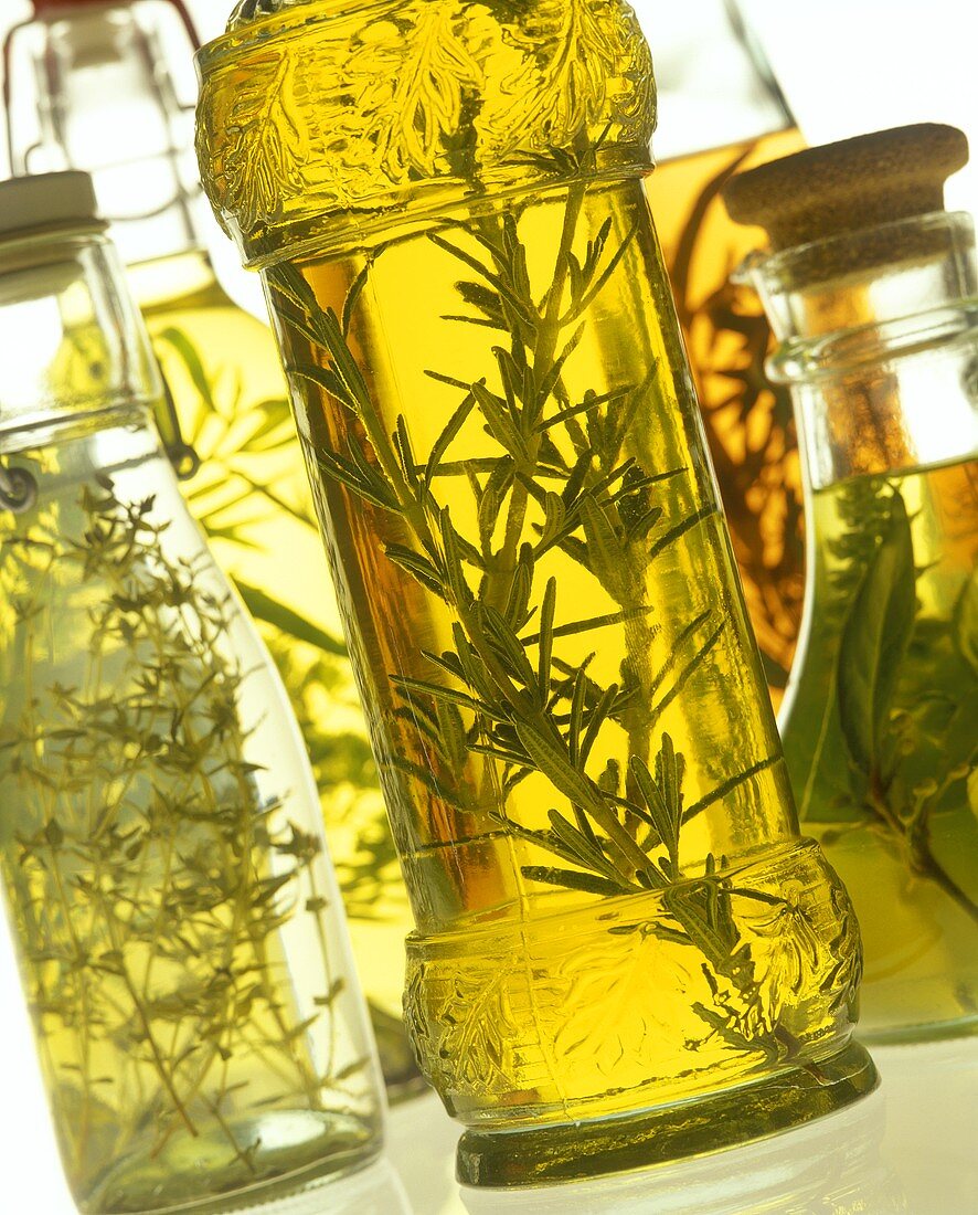Various types of herb oil and vinegar in bottles