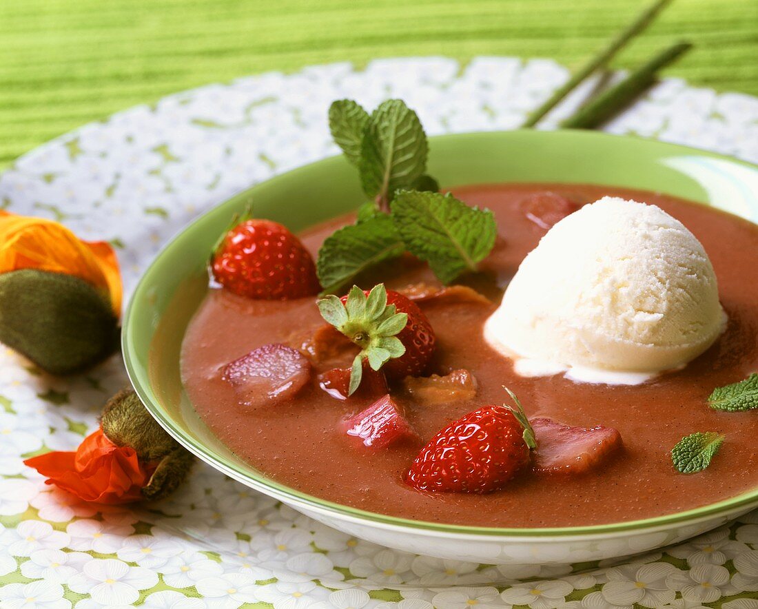 Rhubarb soup with vanilla ice cream and fresh strawberries
