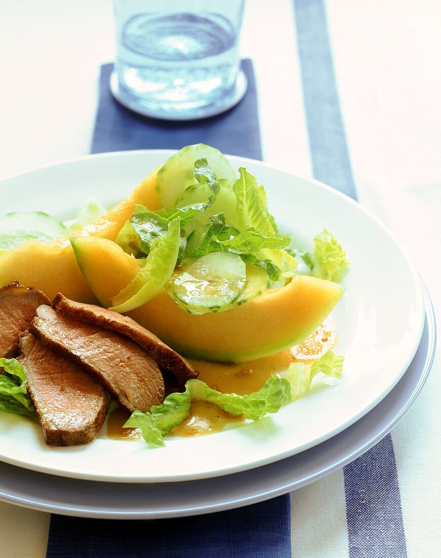 Salad with melon and duck breast