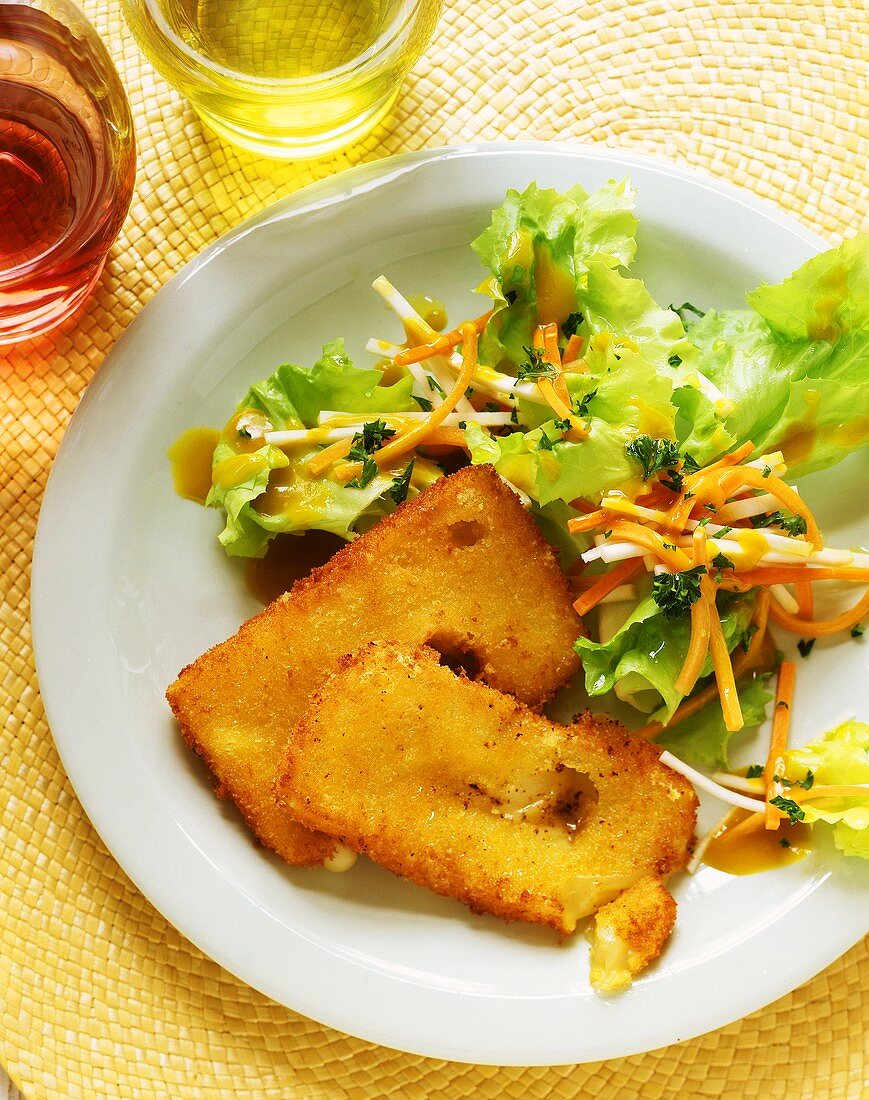 Baked Emmental cheese with salad