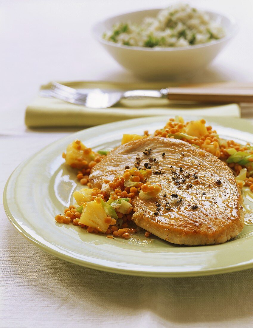 Turkey escalope on lentils with pineapple; rice