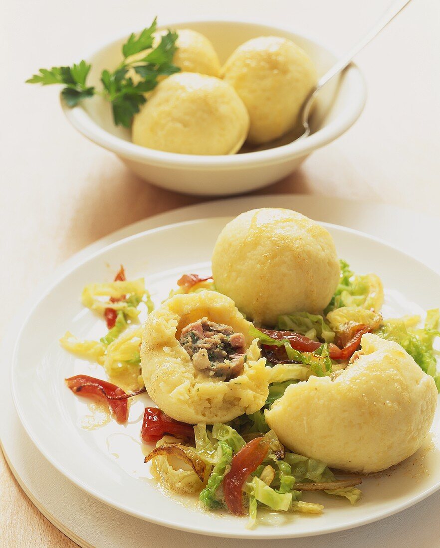 Stuffed potato dumplings on savoy