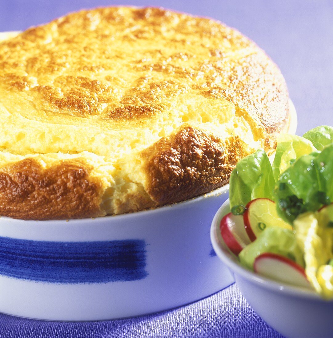 Cheese soufflé with green salad