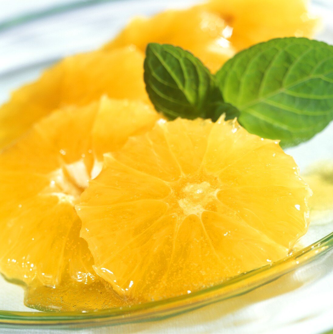 Oranges in honey with fresh mint