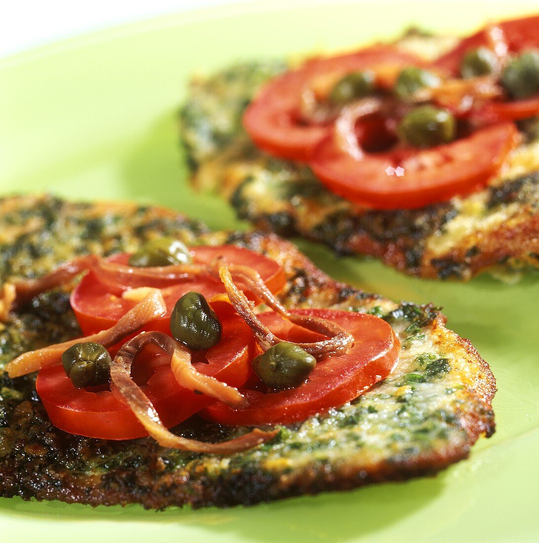 Spicy herb escalope with tomatoes and capers