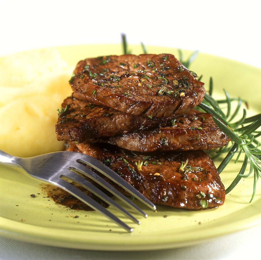 Minute steaks with mashed potato and rosemary