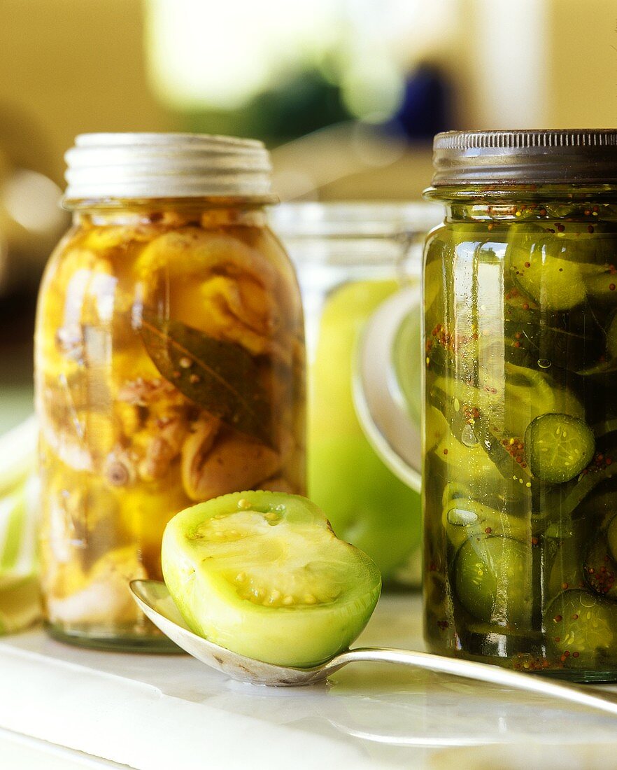 Pickled vegetables in jars (gherkins, tomatoes etc.)