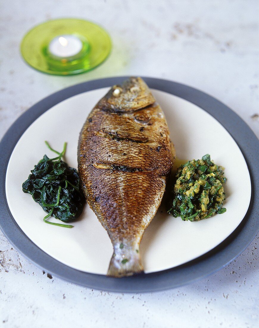 Fried bream with spinach