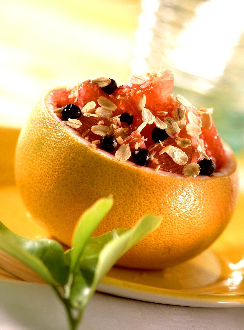 Grapefruit stuffed with oat flakes and blueberries
