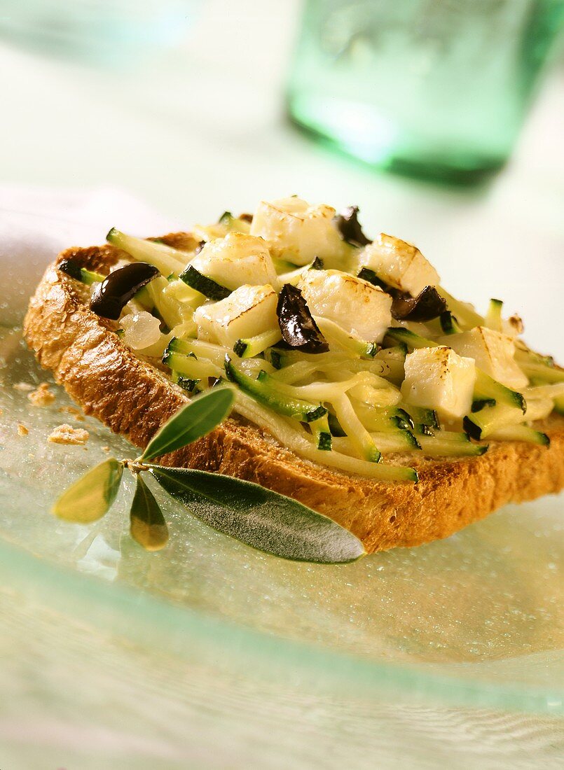 Courgettes and olives on toast with feta