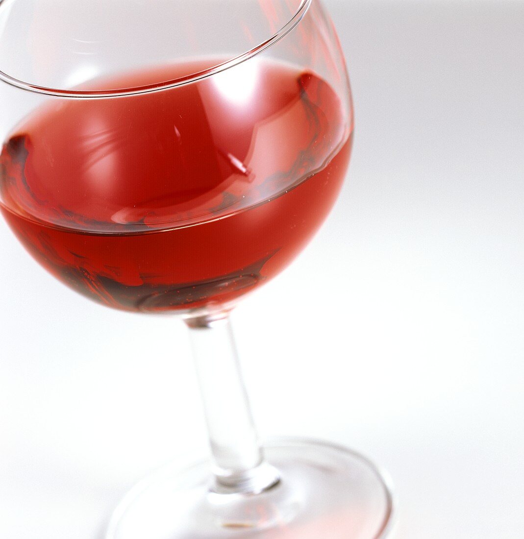 Glass of red wine, half-full