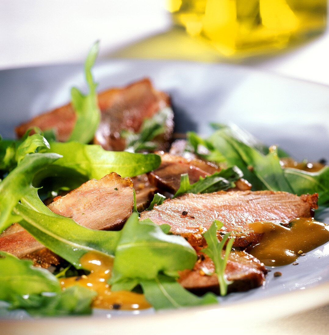 Duck breast with balsamic vinaigrette and rocket