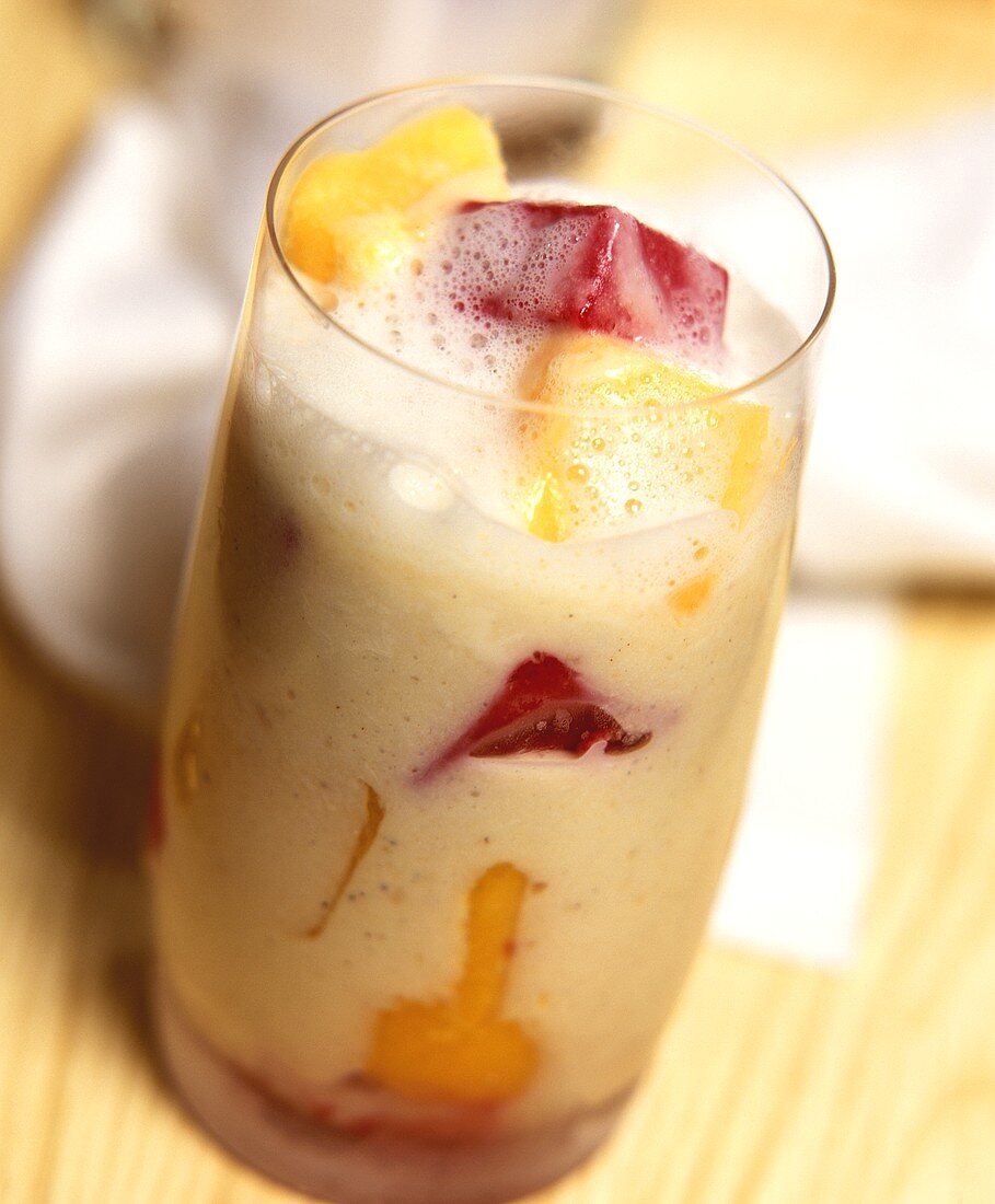 Mango and melon milkshake in glass