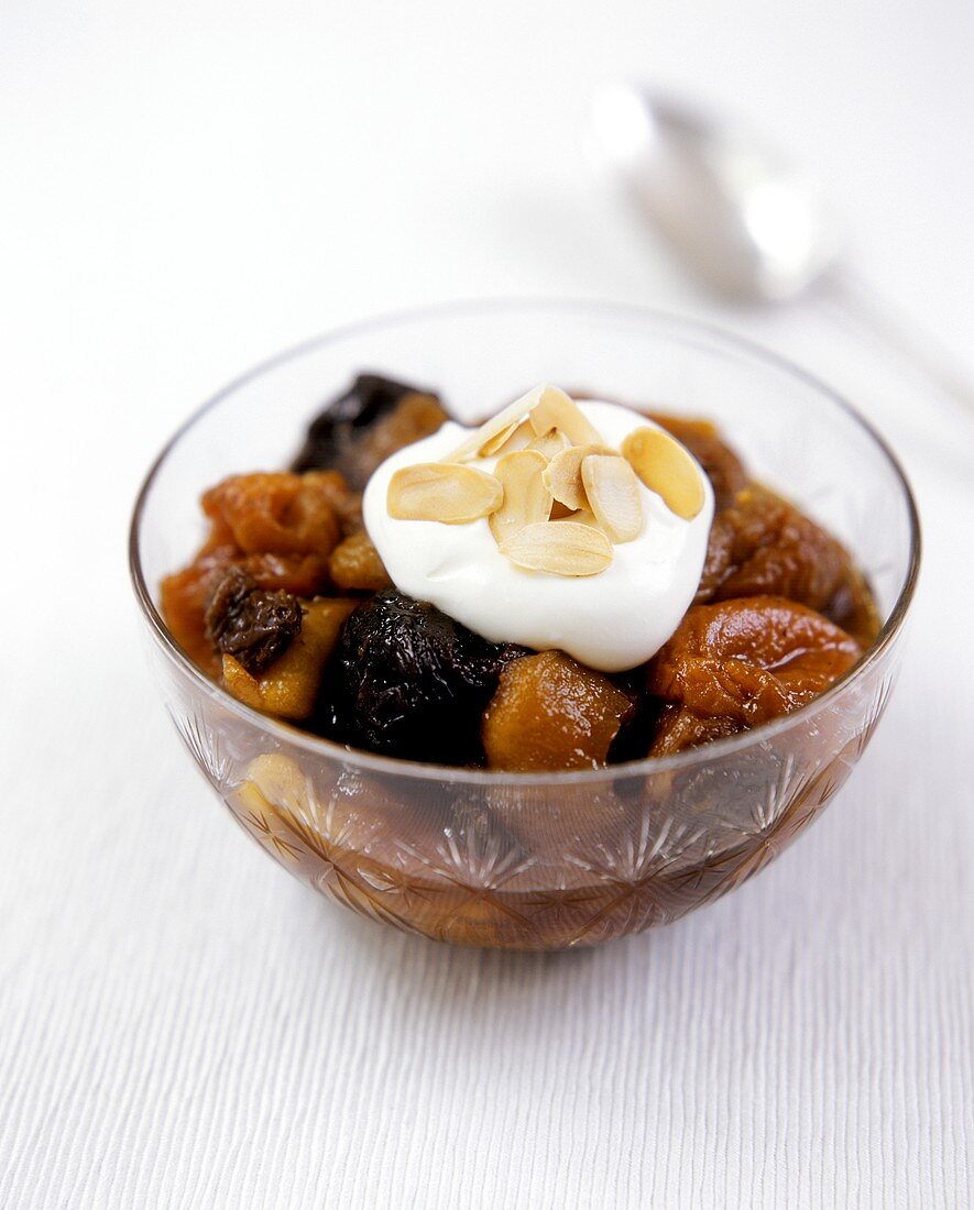 Compote with cream and flaked almonds