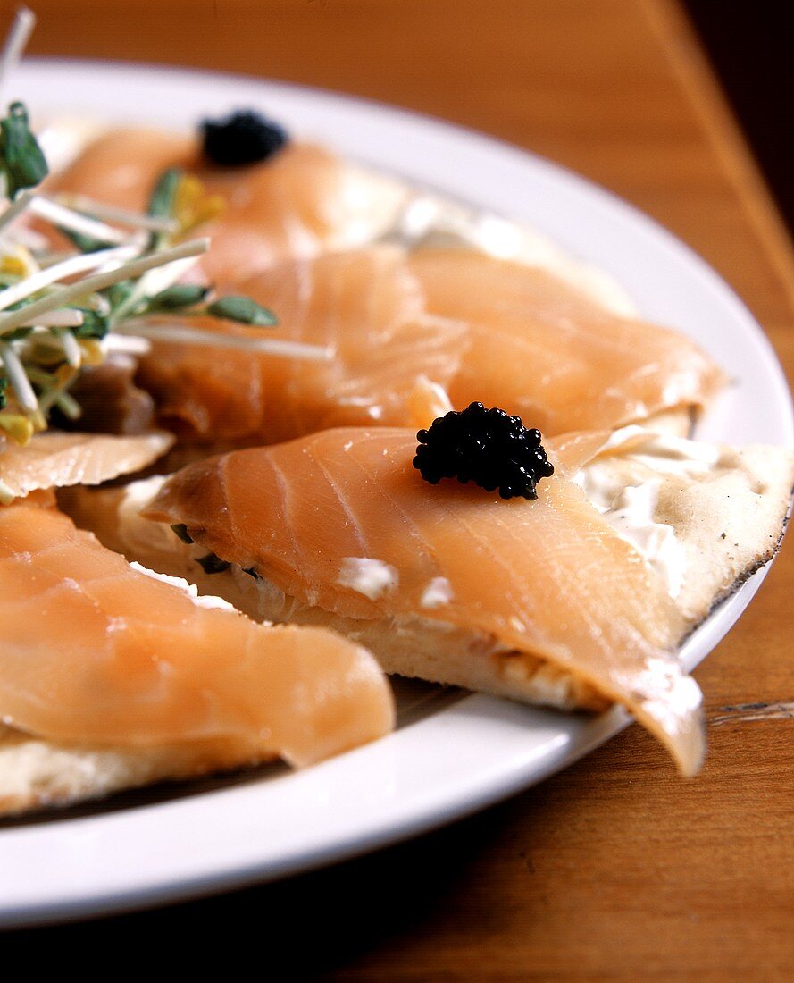 Pizza with smoked salmon and caviare