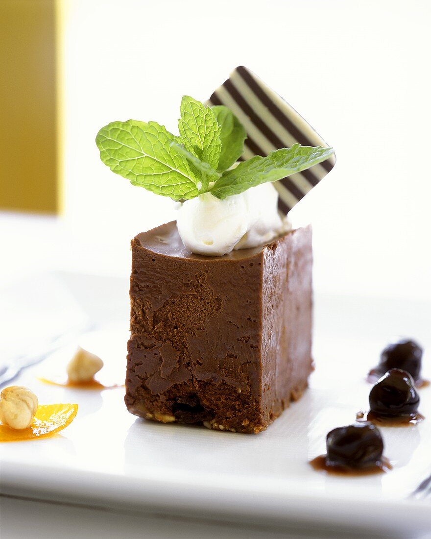 Chocolate terrine with cream and candied cherries