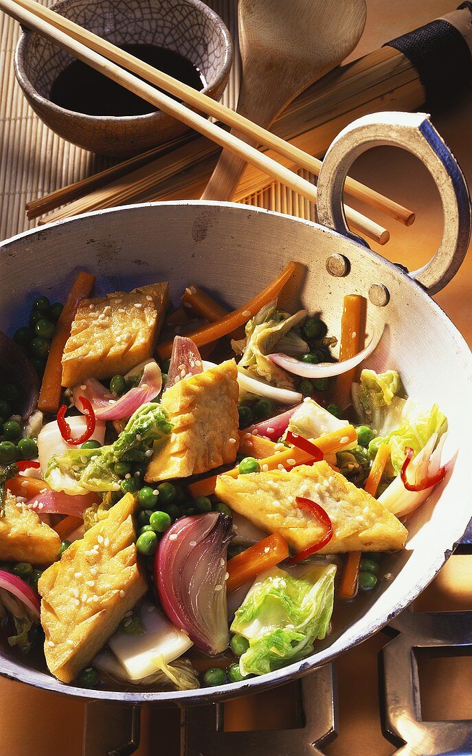 Wok-cooked vegetables with tofu and sesame; soy sauce