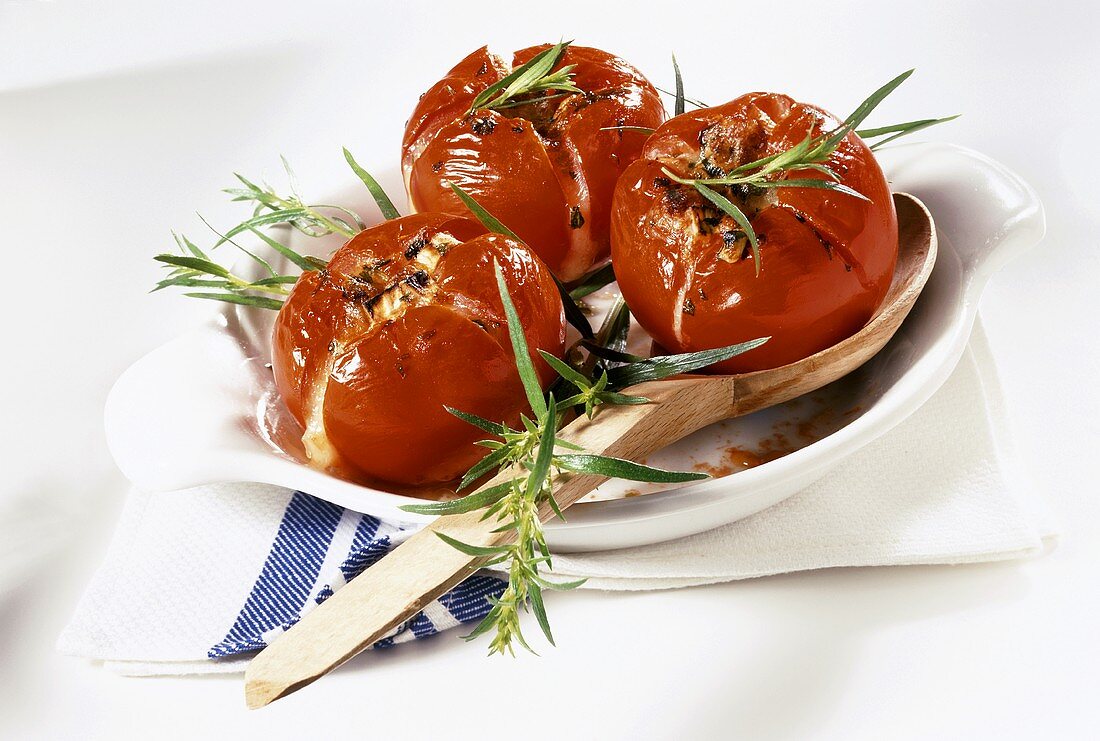 Baked tomatoes with goat's cheese stuffing and tarragon