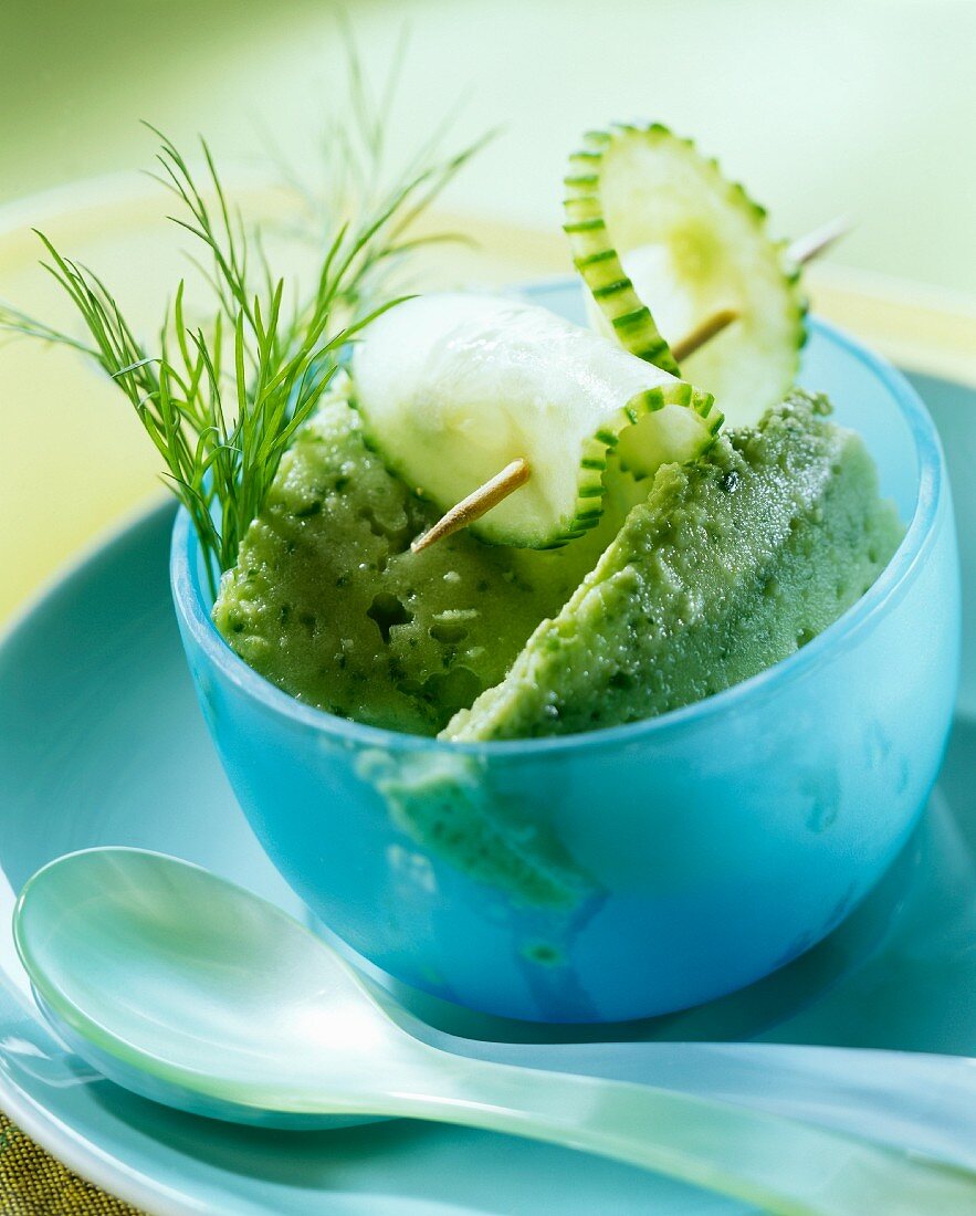 Savoury cucumber ice cream in blue bowl