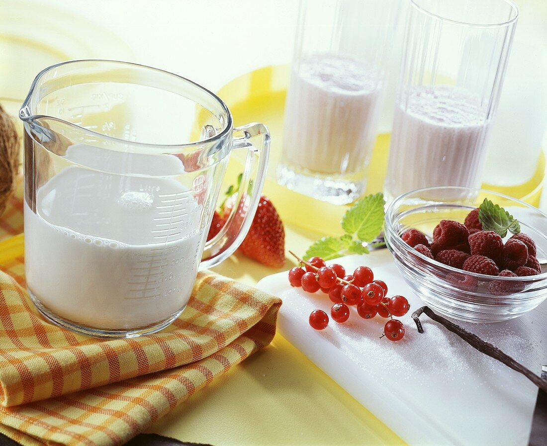 Ingredients for berry shakes: milk and fresh berries