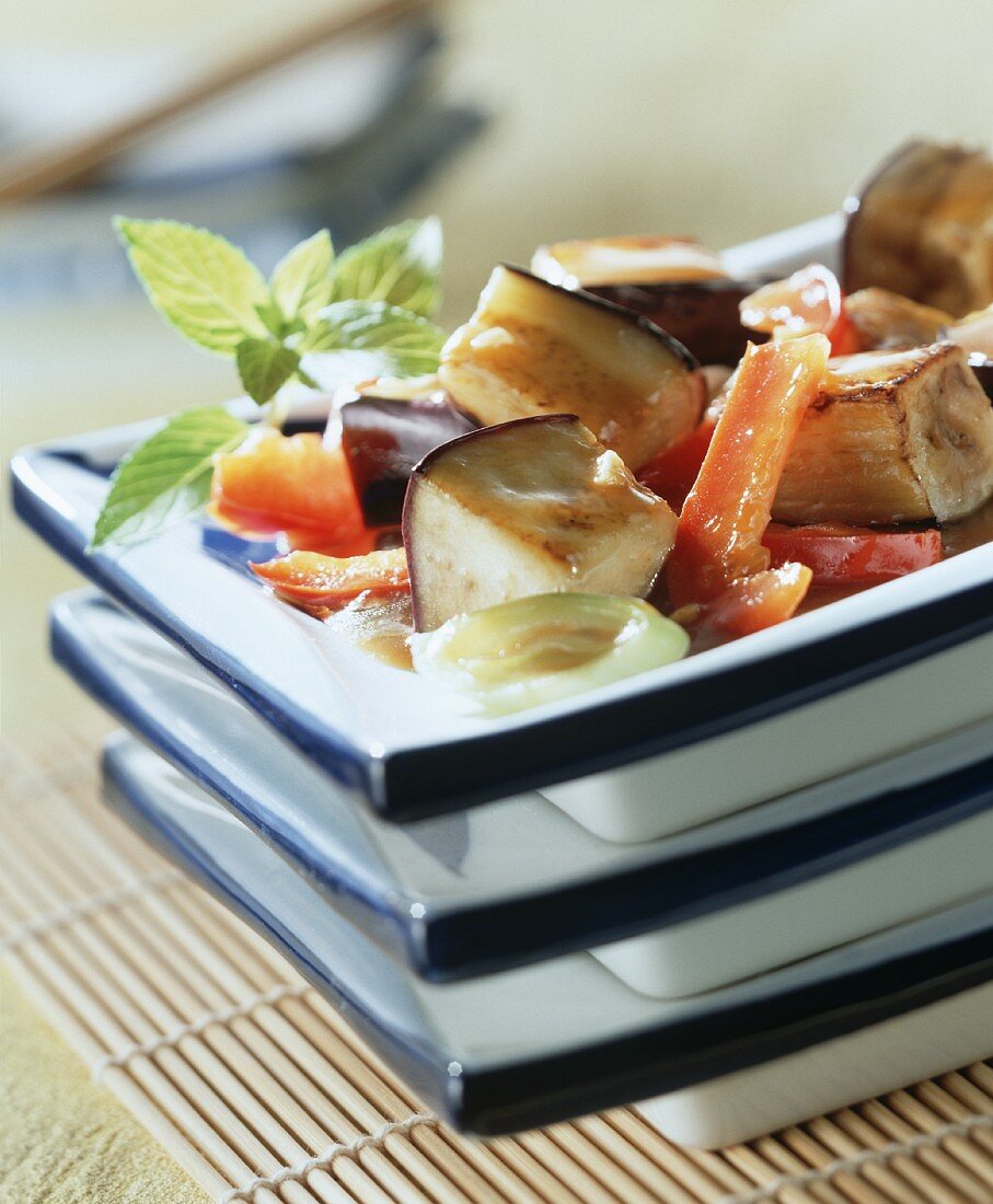 Aubergines in rice wine with peppers and mint