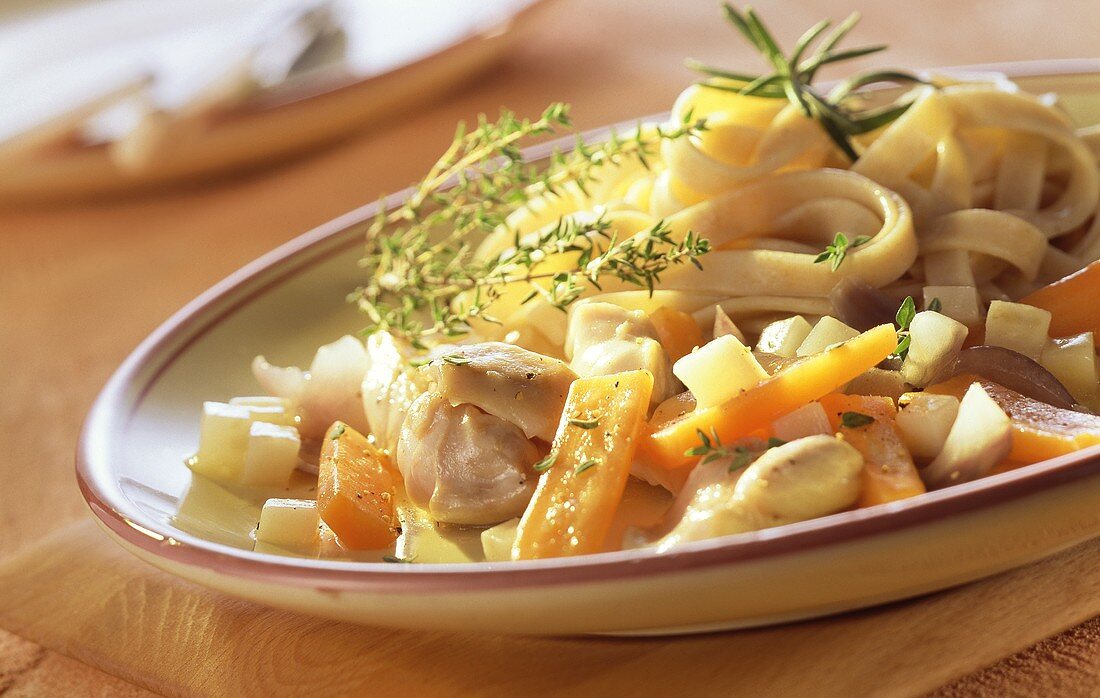 Rabbit ragout with carrots and ribbon pasta