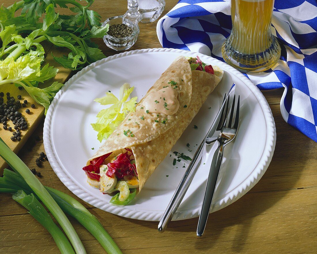 Weisswurst (white sausage) wrap with radicchio & celery; beer
