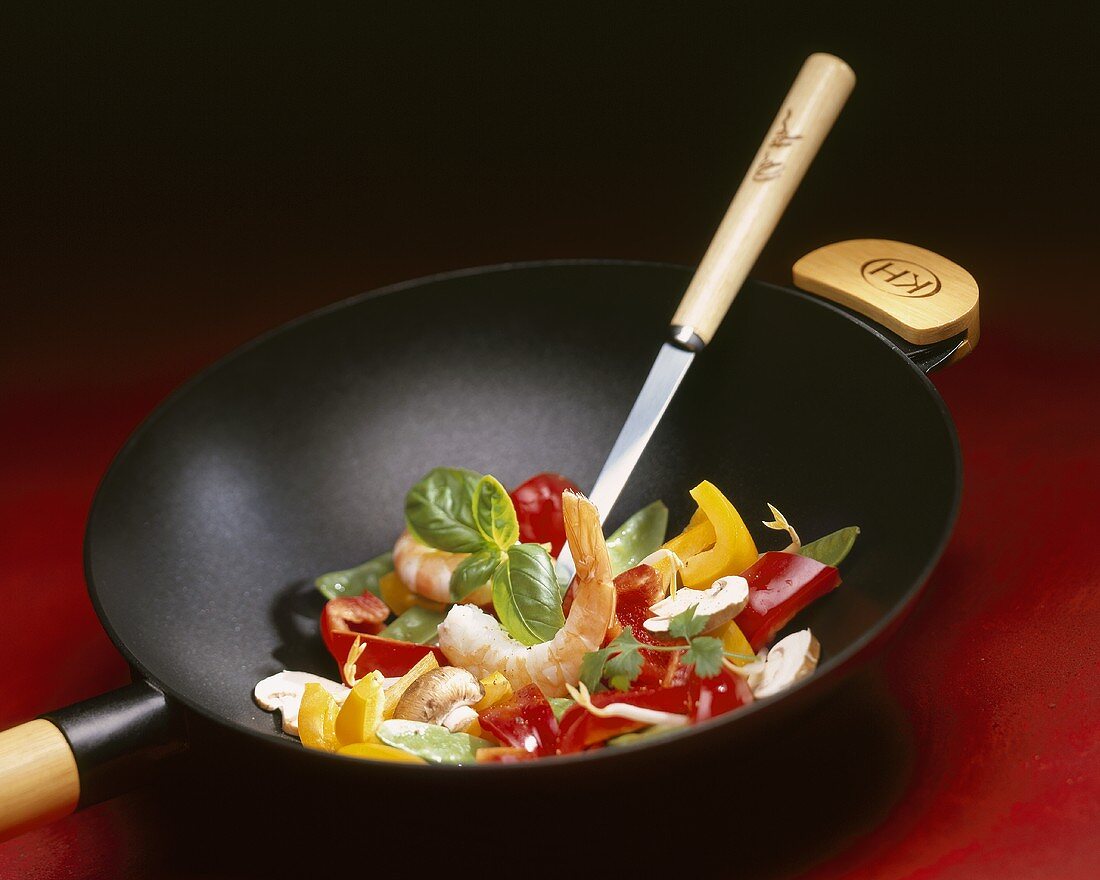 Vegetables, mushrooms and shrimps in wok