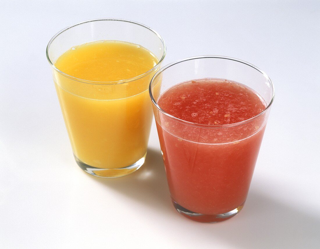 Orange juice and blood orange juice in glass