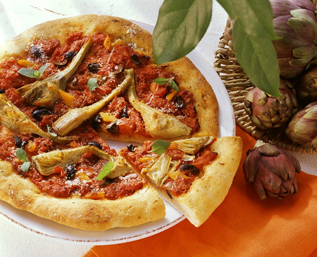 Artichoke pizza with tomatoes and olives