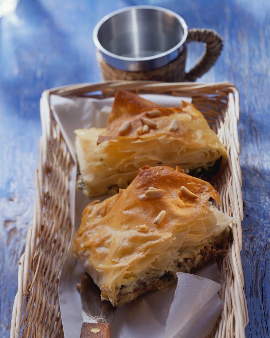 Sheep's cheese & spinach börek with pine nuts in basket