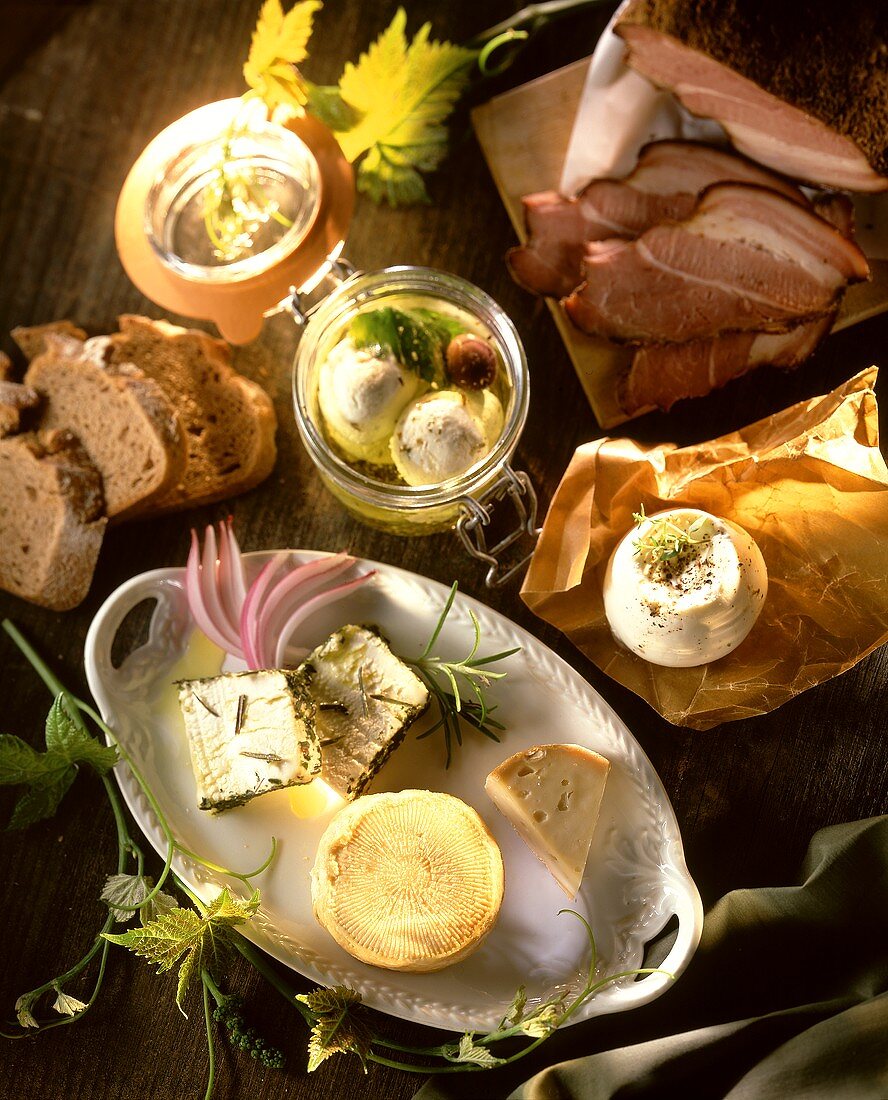 Various types of cheese, bacon and bread