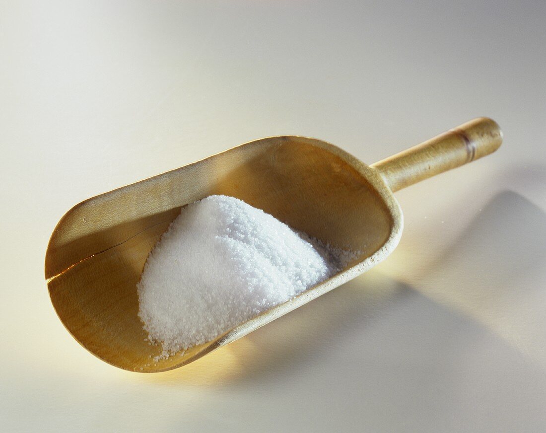 Salt on wooden scoop